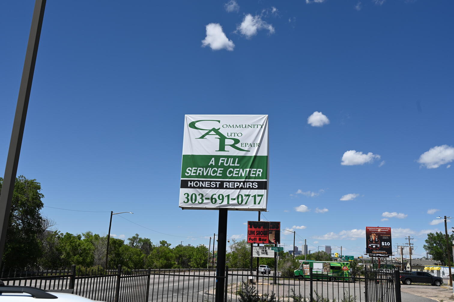 Community Auto Repair roadside sign on South Santa Fe Drive